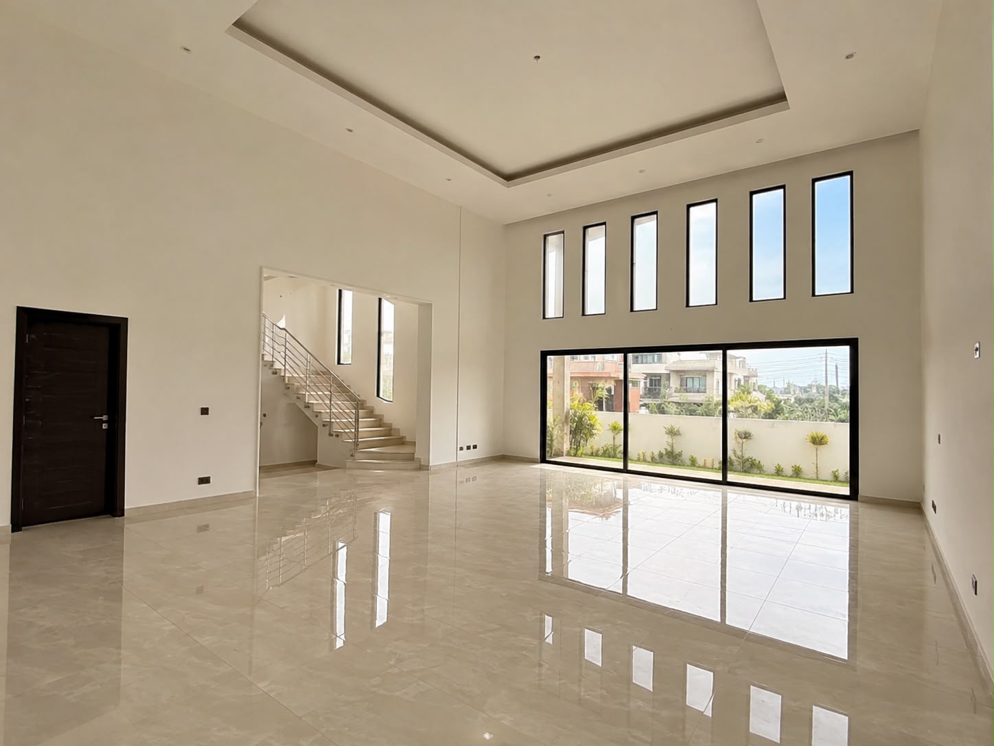 Double-height living room with feature windows